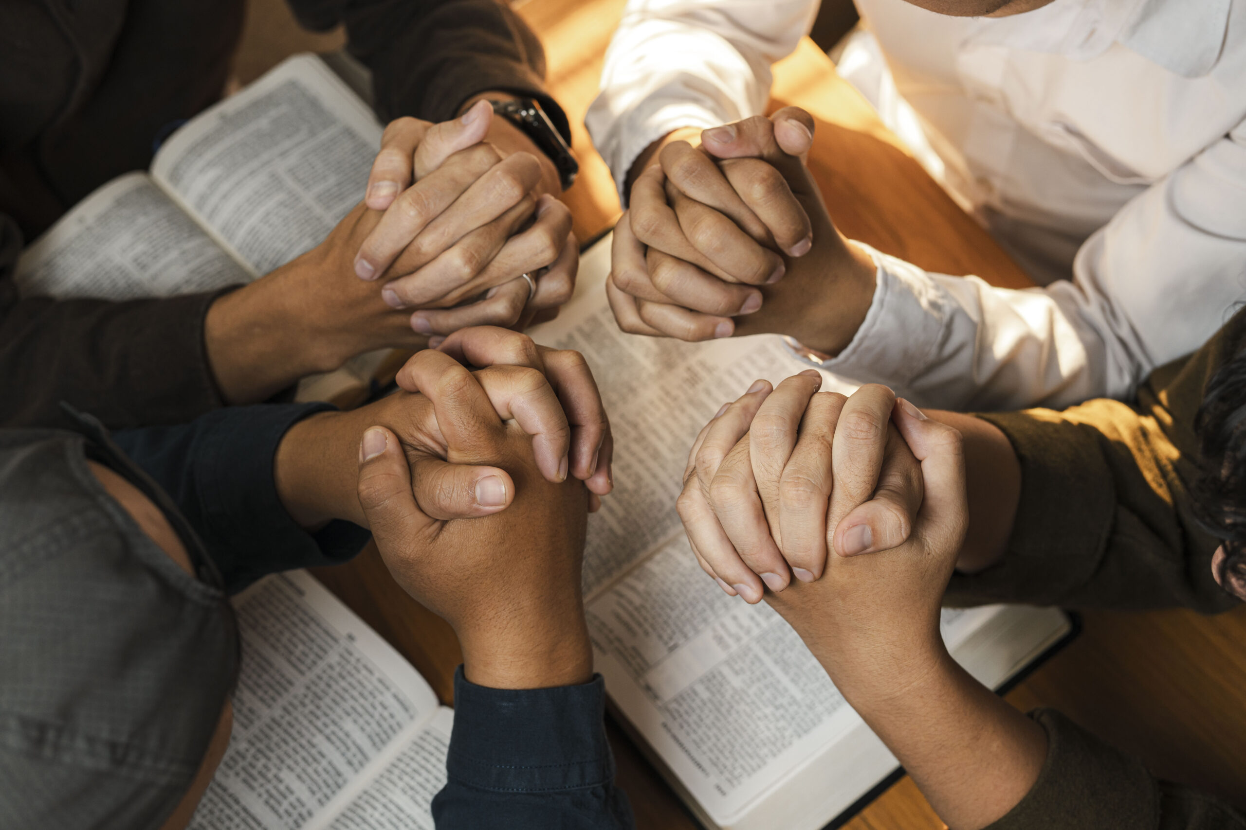 A group of young Christians working together to pray and seek